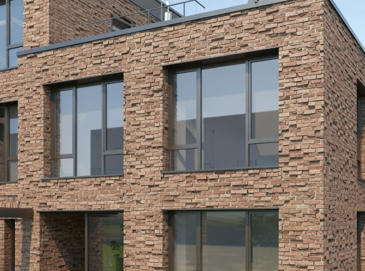 Fachada de ladrillo cara vista con deterioro por humedad y ciclos de hielo-deshielo